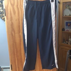 Nike Capri pants. Size small. Dark blue with white trim and embroidered logo.